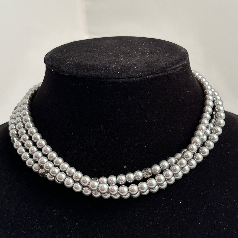 Silvery gunmetal triple strand pearl necklace with magnetic rhinestone closure